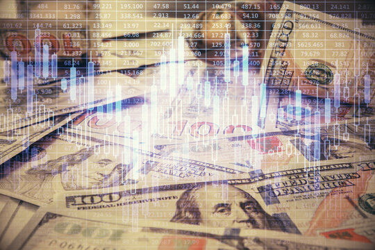 Multi exposure of forex chart drawing over us dollars bill background. Concept of financial success markets. © peshkova