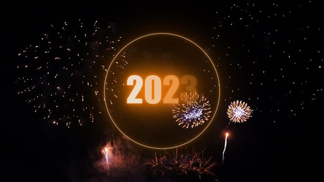 Year 2023 in orange colors with real fireworks, Happy new year