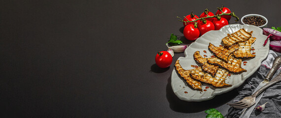 Fried slices Pleurotus eryngii mushrooms with balsamic sauce and sesame seeds. Spices and herbs