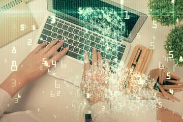 Double exposure of woman hands working on computer and data theme hologram drawing. Top View. Technology concept.