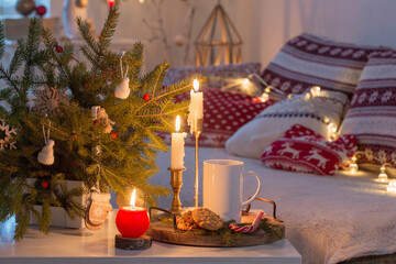 christmas home decorations with candles in red and white colors