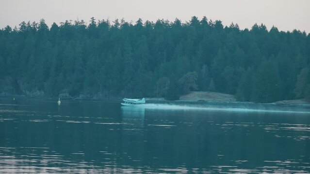 Float Plane taking off at sunrise, Vancouver Island