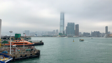 Naklejka premium Hong Kong, China, November 2016 - A large body of water with a city in the background