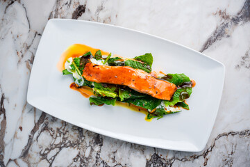 Roasted salmon steak with spinach Healthy meal