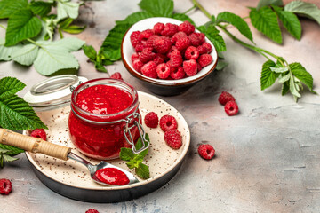 Raspberry jam with berry on light background. Homemade jam with raspberry. banner, menu, recipe place for text, top view
