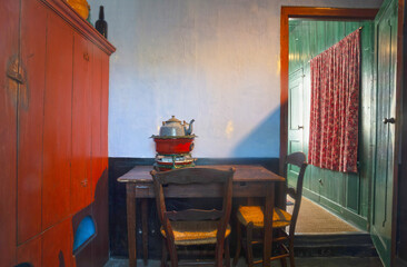 Old antique metallic red kettle with auto-heating