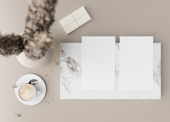 Two white vertical flyer mock ups with vase and other home accessories on beige table. Paper sheet, blank template for your design. Top view, close-up. Brochure, invitation presentation. 3D rendering.