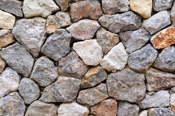 modern hard stone stack or rock wall dam and vintage brown gray granite floor or black yellow jigsaw on top view for strong background or texture backdrop and wallpaper with architectural construction