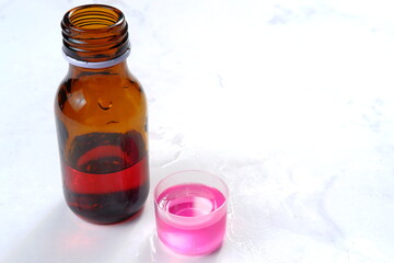 Cough and Cold syrup isolated on white background