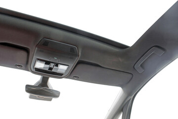 Looking up from inside a modern car through a sun roof and windows.