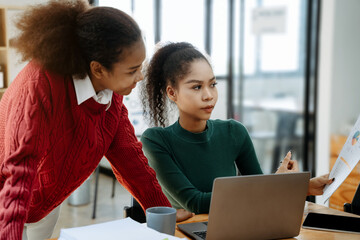 Asian women business people discussing on performance revenue in meeting. businessman working with co-worker team. financial adviser analysing data with investor.