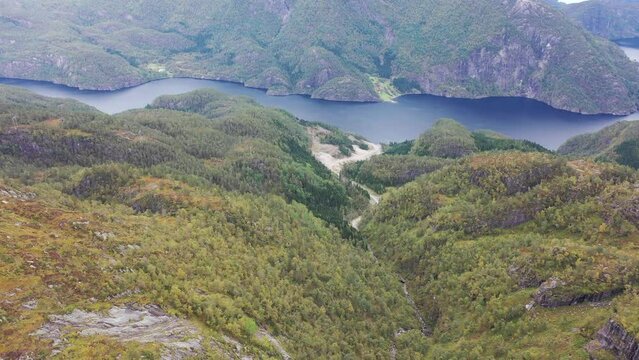 Aerial towards Bolstadfjorden in Vaksdal Norway - Looking down at damaged nature due to building of hydroelectric powerplant Markaani