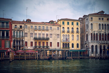 Fototapeta na wymiar Traditional venetian houses and architecture style view across the Grand Canal in Venice, Italy