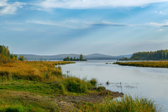 Autumn landscape sunset on the river bank. Wonderful nature, beautiful natural background.