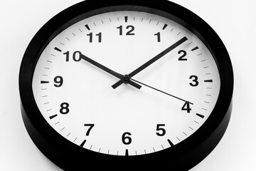 Round wall black and white clock. Time to work or rest concept