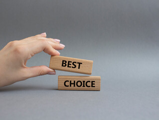 Best choice symbol. Wooden blocks with words Best choice. Beautiful grey background. Businessman hand. Business and Best choice concept. Copy space.