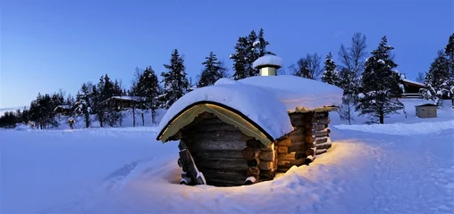 Poster Santa Claus Village under the blue starry sky. A snow-covered winter. Santa Claus Village in Rovaniemi, Lapland, Finland. © twabian