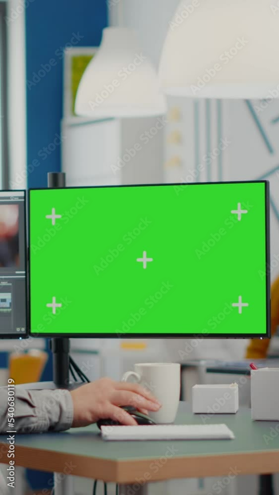 Poster videographer using computer with chroma key, mock up isolated display editing video and audio footag