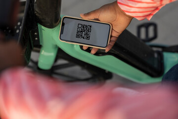 Scanning a code to rent e-bike for a city ride