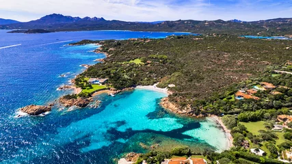 Poster Italy summer holidyas . Sardegna island - stunning Emerald coast (Costa Smeralda) with beautiful beaches. aerial view of small Romazzino beach. © Freesurf