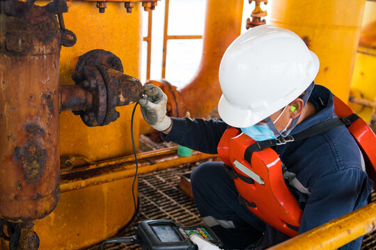 Inspectors inspect pipes severe corrosion the petrochemical industry oil and gas with ultrasonic instruments.