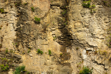 brown rock wall. Embankment of astronauts. Tbilisi Georgia