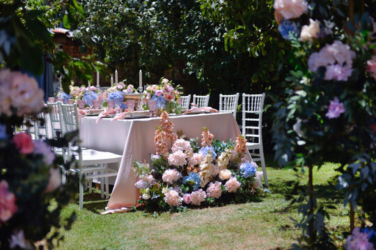 well decorated wedding table at  a backyard  garden 