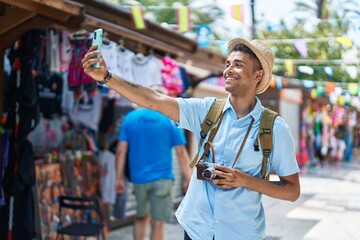 African american man tourist smiling confident make selfie by the smartphone at street market