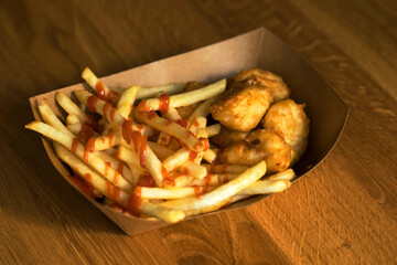 Fries with catchup and chicken wings