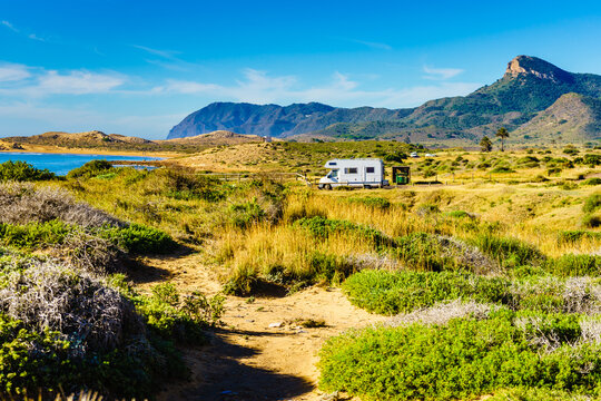 Spanish coast with caravan camping in the distance