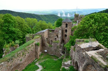Fototapeta na wymiar The ruins of the Gothic Hasištejn castle with a view of the Prunéřov power plant