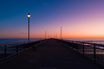 Fototapeta na wymiar Perspective view of New Brighton Pier at dawn, Christchurch, New Zealand.