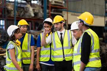 Unity and teamwork concept. team standing hands together. Professional Mechanical Engineer team Working at Second-hand spare parts of old car parts warehouse store. High five.