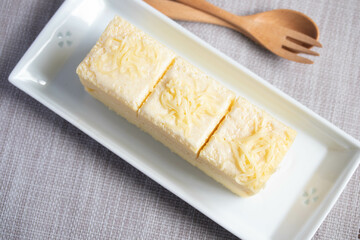 Vanilla cream cake in white plate