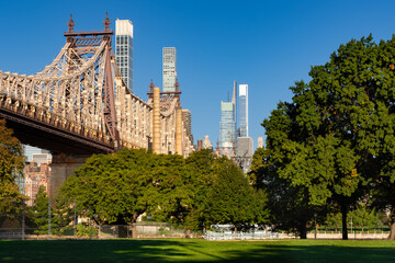 Queensboro Bridge in summer from Queensbridge Park in Long Island City. View of Upper East Side skyscrapers, Manhattan, New York