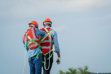 Construction worker wearing safety harness and safety line,Equipment of industrial worker high...