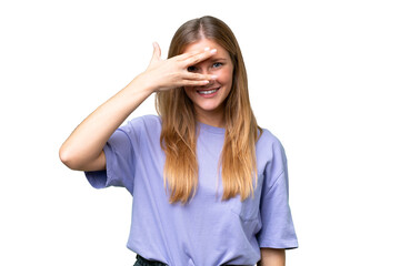 Young beautiful woman over isolated background covering eyes by hands and smiling