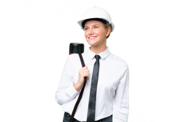 Young architect caucasian woman with helmet and holding blueprints over isolated background happy and smiling