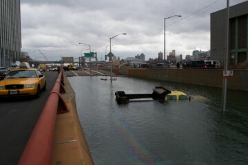 The Department of Transportation truck that became one of the most symbolic examples of impact of Hurricane Sandy sits flooded by the residual storm surge in the Battery Underpass on Oct 31st 2012 - obrazy, fototapety, plakaty
