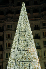 christmas tree decoration in a modern city center at night