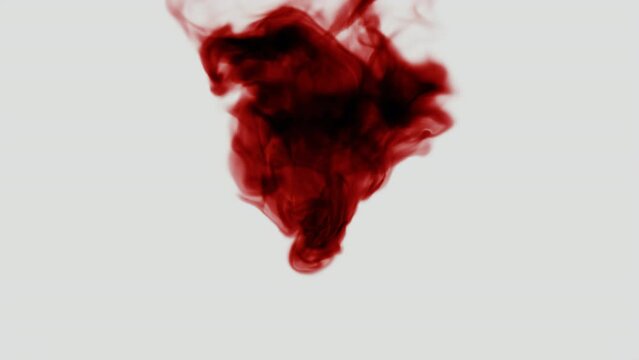 Fluorescent Red Ink Dissolves in Water on White Background in Slow Motion 4K, ProRes 442
