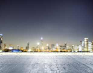 Empty concrete dirty rooftop on the background of a beautiful blurry Chicago city skyline at night, mockup