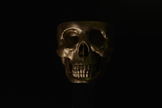 Gold human Skull Isolated on black background