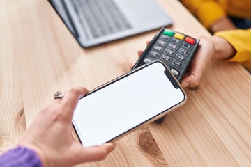 Young woman ecommerce business worker collect using smartphone and data phone at office