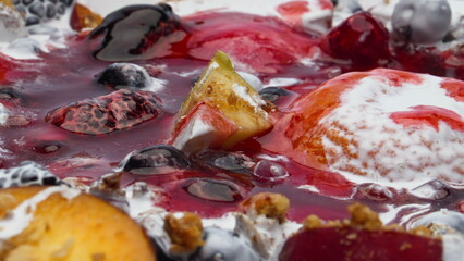 Sweet porridge fruits jam with natural yogurt close up. Muesli for breakfast.