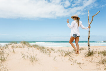 Woman on pristine seculuded beach Australia good vibes