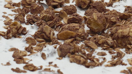 Chocolade granola fresh yogurt rotating super slow motion close up. Healthy food