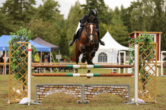 A girl and her horse in show jumping, Gotland Sweden.