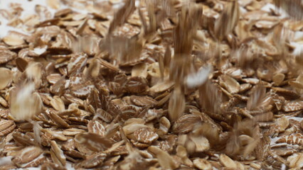 Preparing oatmeal natural yogurt for breakfast in super slow motion close up.