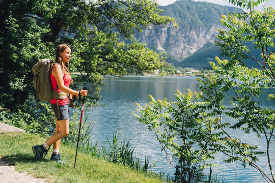 Hiker admiring nature standing near Lake Levico